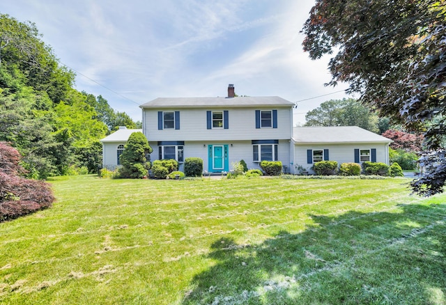 10 Harvard Ter, Norwich, CT 06360 - colonial house featuring a chimney and a front lawn