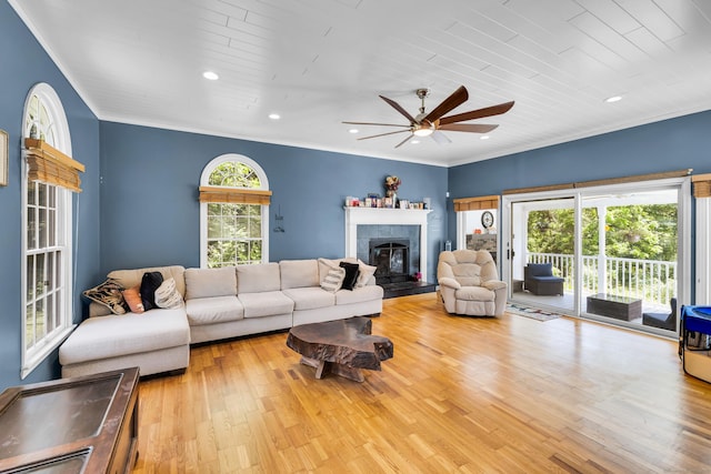 10 Harvard Ter, Norwich, CT 06360 - living room with ceiling fan, wood finished floors, a tile fireplace, recessed lighting, and ornamental molding