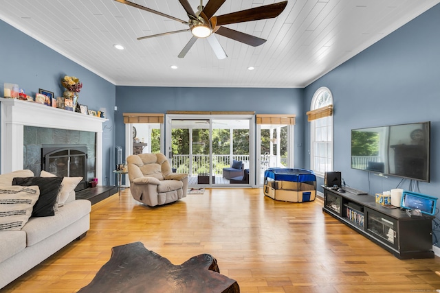 10 Harvard Ter, Norwich, CT 06360 - living room featuring a ceiling fan, a tiled fireplace, wood finished floors, recessed lighting, and ornamental molding