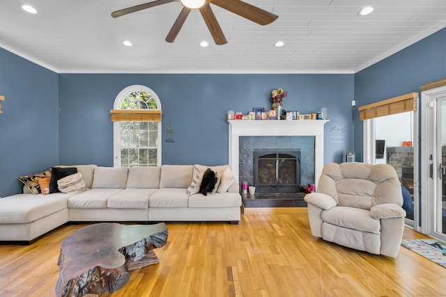 10 Harvard Ter, Norwich, CT 06360 - living area with ceiling fan, crown molding, recessed lighting, a tile fireplace, and wood finished floors