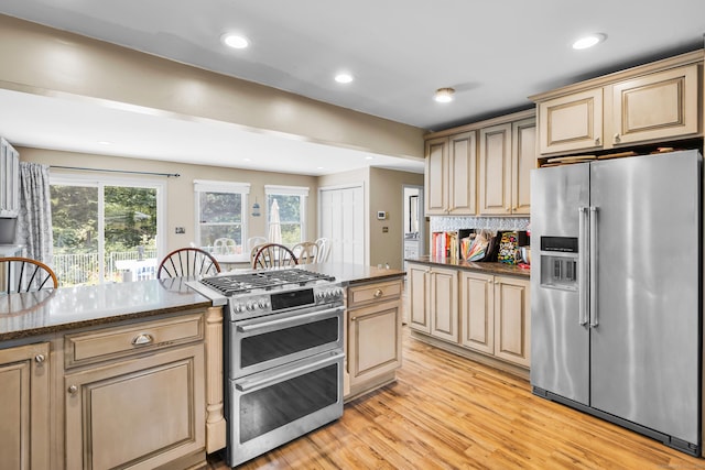 10 Harvard Ter, Norwich, CT 06360 - kitchen featuring stainless steel appliances, light wood-style flooring, recessed lighting, backsplash, and dark stone countertops