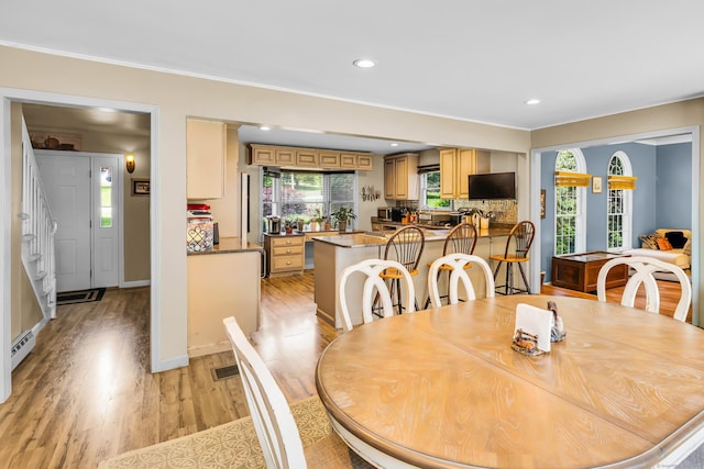 10 Harvard Ter, Norwich, CT 06360 - dining space with light wood-style floors, baseboard heating, recessed lighting, and crown molding
