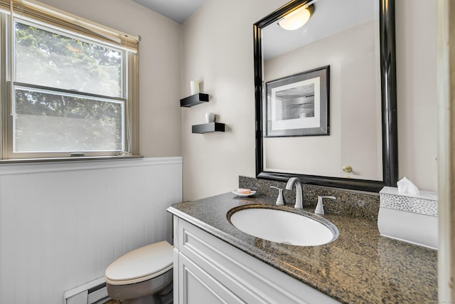 10 Harvard Ter, Norwich, CT 06360 - bathroom featuring vanity, a baseboard heating unit, and wainscoting