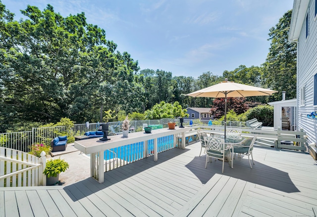 10 Harvard Ter, Norwich, CT 06360 - wooden terrace featuring outdoor dining space, outdoor lounge area, and view of scattered trees