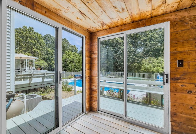 10 Harvard Ter, Norwich, CT 06360 - doorway featuring hardwood / wood-style flooring, wood ceiling, and view of scattered trees