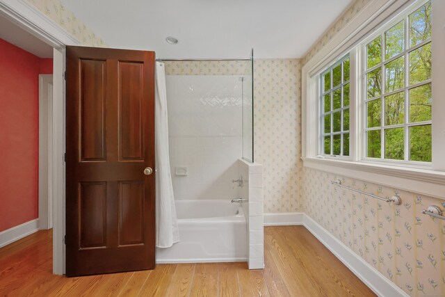 70 Sill Ln, Old Lyme, CT 06371 - bathroom with wood finished floors, wallpapered walls, baseboards, and shower / bath combo with shower curtain