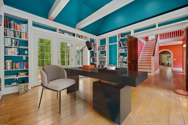70 Sill Ln, Old Lyme, CT 06371 - home office featuring built in shelves, arched walkways, hardwood / wood-style floors, french doors, and beam ceiling