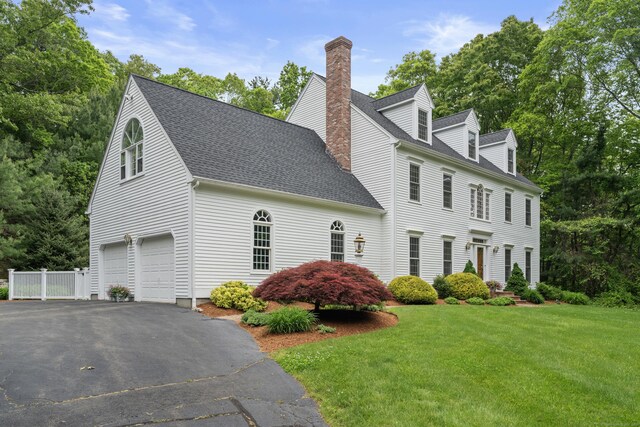 262 Fairview Rd, Westbrook, CT 06498 - view of home's exterior with a garage, a chimney, a yard, asphalt driveway, and a shingled roof