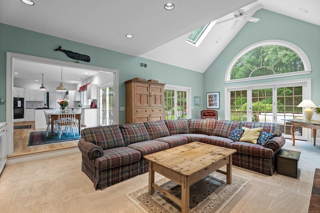 262 Fairview Rd, Westbrook, CT 06498 - living room featuring high vaulted ceiling, recessed lighting, light colored carpet, a skylight, and a ceiling fan