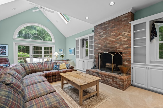 262 Fairview Rd, Westbrook, CT 06498 - living area featuring a skylight, light carpet, a ceiling fan, high vaulted ceiling, and a brick fireplace