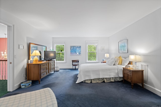 262 Fairview Rd, Westbrook, CT 06498 - bedroom featuring dark colored carpet, baseboards, and a chandelier