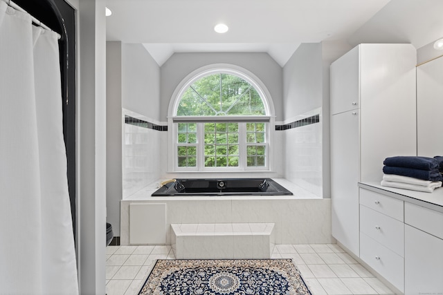 262 Fairview Rd, Westbrook, CT 06498 - full bathroom with tile patterned flooring, lofted ceiling, tiled tub, and a shower with shower curtain