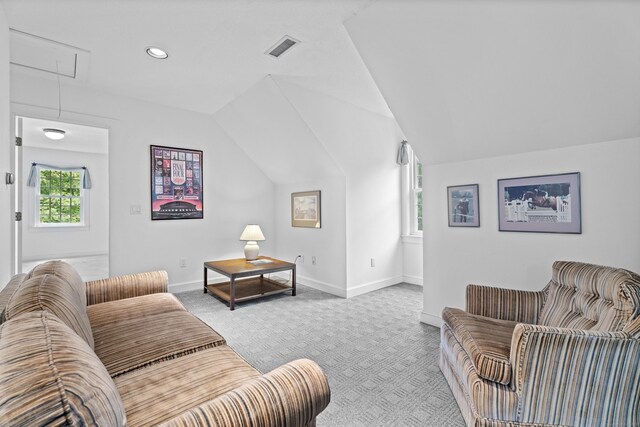 262 Fairview Rd, Westbrook, CT 06498 - living area featuring attic access, light carpet, vaulted ceiling, healthy amount of natural light, and baseboards