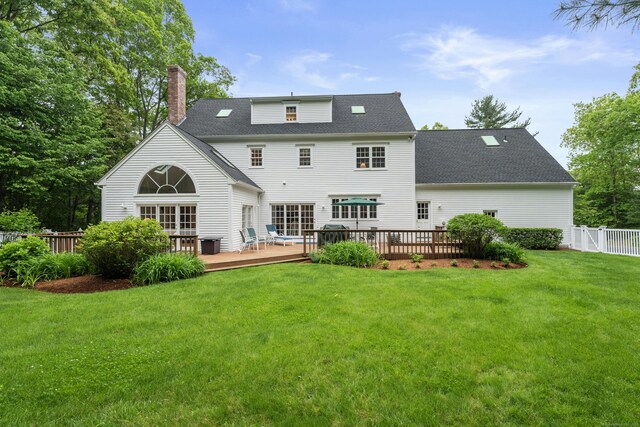 262 Fairview Rd, Westbrook, CT 06498 - rear view of house featuring a deck, a chimney, and a shingled roof