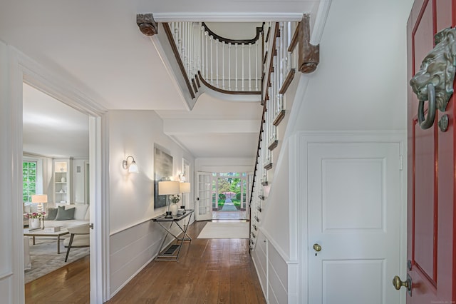 379 Hurlbutt St, Wilton, CT 06897 - foyer entrance with stairs, dark wood-type flooring, and a wainscoted wall