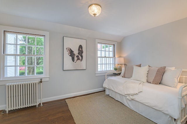 379 Hurlbutt St, Wilton, CT 06897 - bedroom with radiator, wood finished floors, baseboards, and lofted ceiling