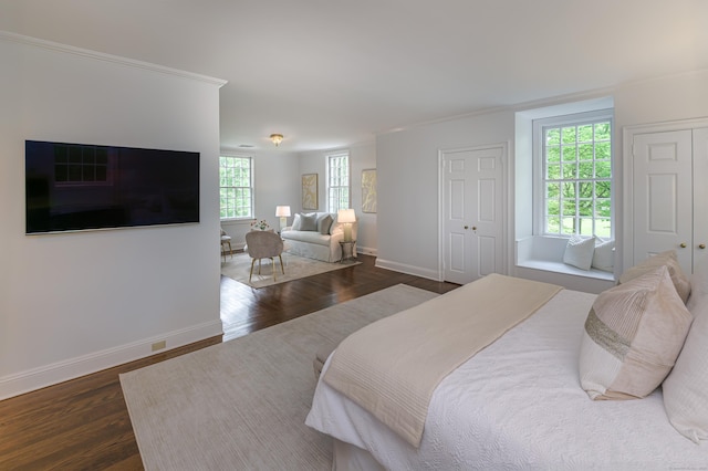 379 Hurlbutt St, Wilton, CT 06897 - bedroom with multiple closets, dark wood-style flooring, and ornamental molding