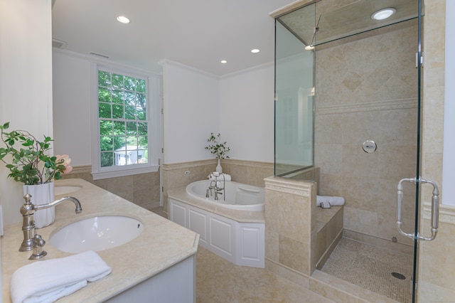 379 Hurlbutt St, Wilton, CT 06897 - bathroom with a stall shower, a bath, double vanity, ornamental molding, and tile patterned flooring
