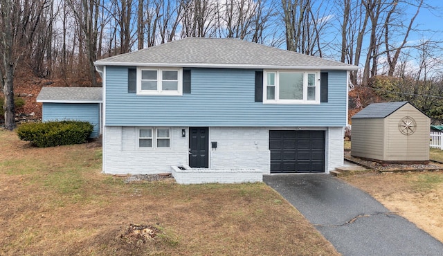 20 Rosengarten Dr, Waterbury, CT 06704 - view of front of home with driveway, a front lawn, an attached garage, and roof with shingles