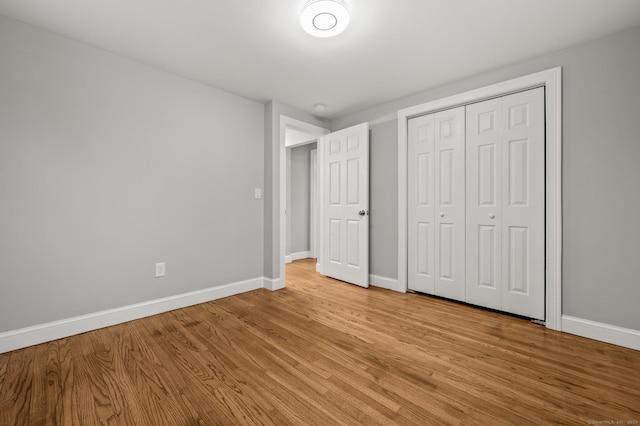 20 Rosengarten Dr, Waterbury, CT 06704 - unfurnished bedroom featuring light wood-type flooring, baseboards, and a closet