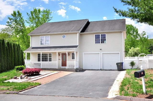 20 Nessa Way, Rocky Hill, CT 06067 - view of front of property featuring driveway, a garage, covered porch, and fence