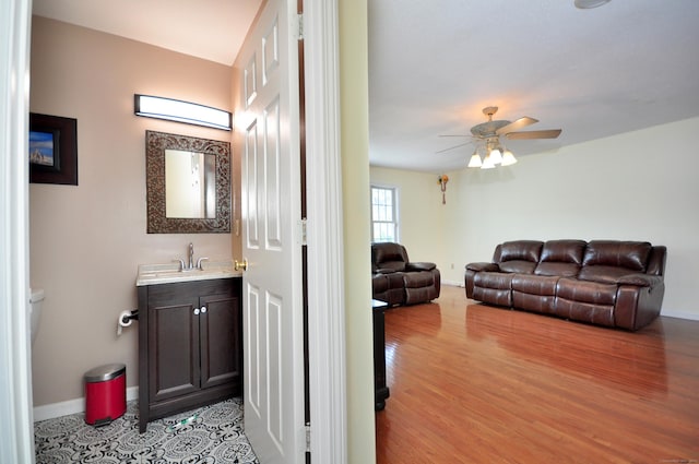 20 Nessa Way, Rocky Hill, CT 06067 - bathroom with baseboards, ceiling fan, and wood finished floors