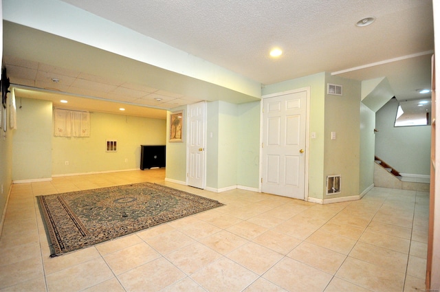 20 Nessa Way, Rocky Hill, CT 06067 - finished below grade area with light tile patterned floors, stairs, recessed lighting, and baseboards