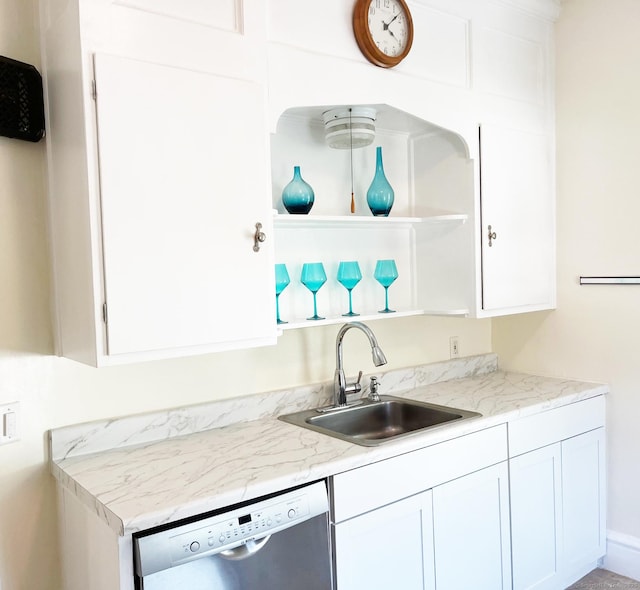 kitchen with a sink, open shelves, white cabinetry, dishwasher, and light countertops