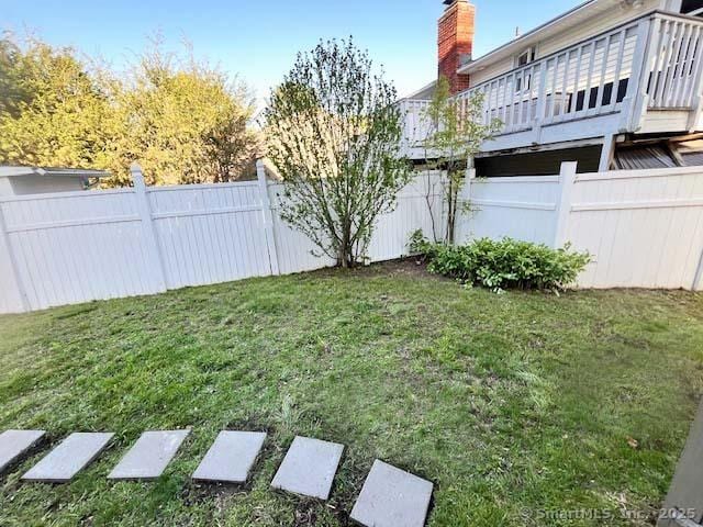 view of yard with a deck