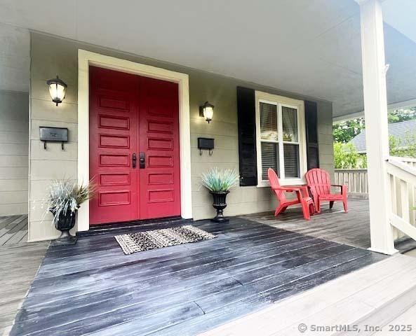 property entrance with covered porch