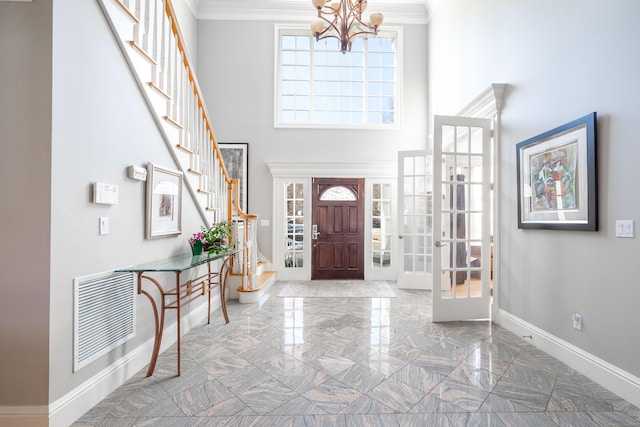 14 Dillman Ct, Ridgefield, CT 06877 - foyer featuring a chandelier, stairs, baseboards, a high ceiling, and crown molding
