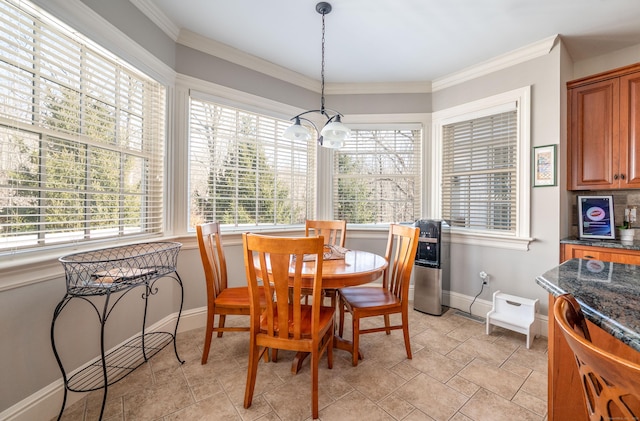 14 Dillman Ct, Ridgefield, CT 06877 - dining area with baseboards, crown molding, and a chandelier