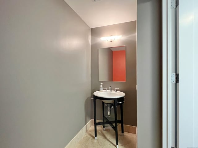 1 Broad St Unit 17C, Stamford, CT 06901 - bathroom featuring baseboards and a sink