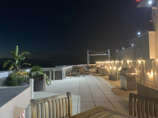 1 Broad St Unit 17C, Stamford, CT 06901 - patio at night with a patio area, area for grilling, and outdoor dining space