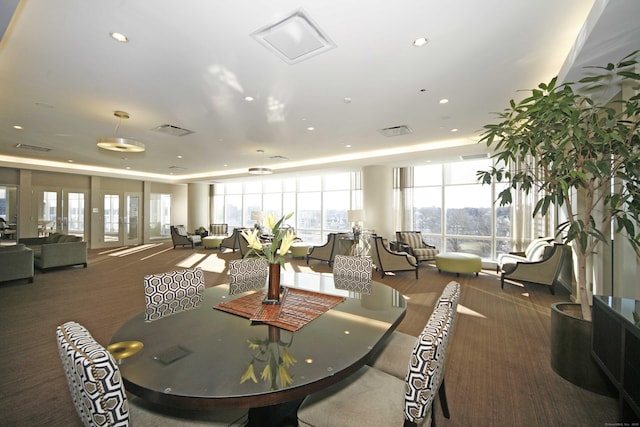 1 Broad St Unit 17C, Stamford, CT 06901 - dining space with carpet floors, plenty of natural light, recessed lighting, and a raised ceiling