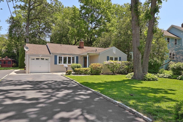 23 Poplar St, Norwalk, CT 06855 - view of front of property with driveway, a garage, a chimney, and a front lawn