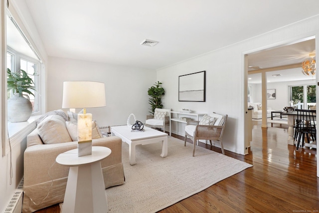23 Poplar St, Norwalk, CT 06855 - living room featuring wood finished floors and a baseboard radiator