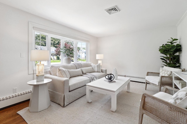 23 Poplar St, Norwalk, CT 06855 - living room featuring a baseboard heating unit, a baseboard radiator, wood finished floors, and baseboards