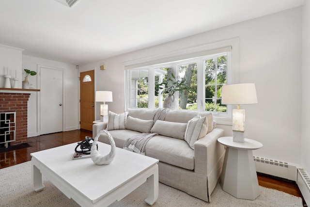 23 Poplar St, Norwalk, CT 06855 - living room with wood finished floors, a baseboard radiator, a fireplace, and baseboards