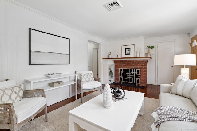 23 Poplar St, Norwalk, CT 06855 - living room with wood finished floors, a brick fireplace, and ornamental molding