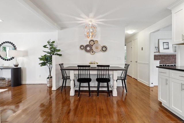 23 Poplar St, Norwalk, CT 06855 - dining room with dark wood-style flooring, a chandelier, and baseboards