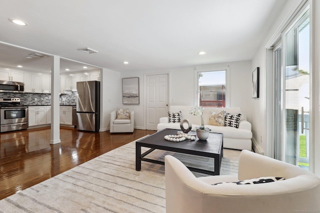 23 Poplar St, Norwalk, CT 06855 - living area featuring dark wood-style flooring and recessed lighting