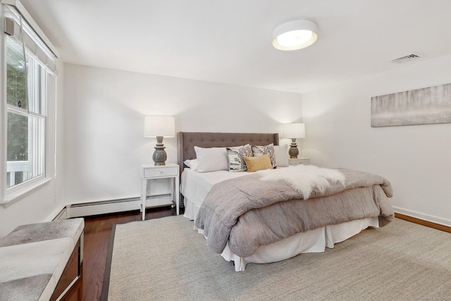 23 Poplar St, Norwalk, CT 06855 - bedroom featuring wood finished floors and baseboard heating