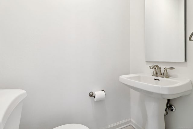 23 Poplar St, Norwalk, CT 06855 - half bathroom featuring toilet and baseboards