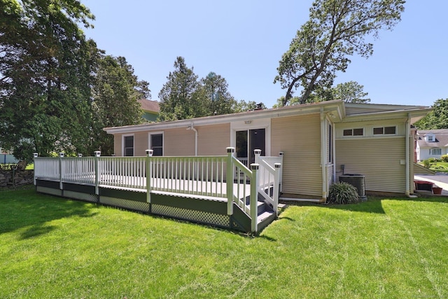 23 Poplar St, Norwalk, CT 06855 - rear view of house featuring central AC unit, a wooden deck, and a lawn