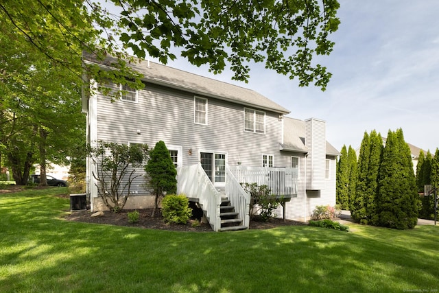 191 Pond View Dr, Watertown, CT 06795 - rear view of house featuring a yard, a deck, central AC, and a chimney