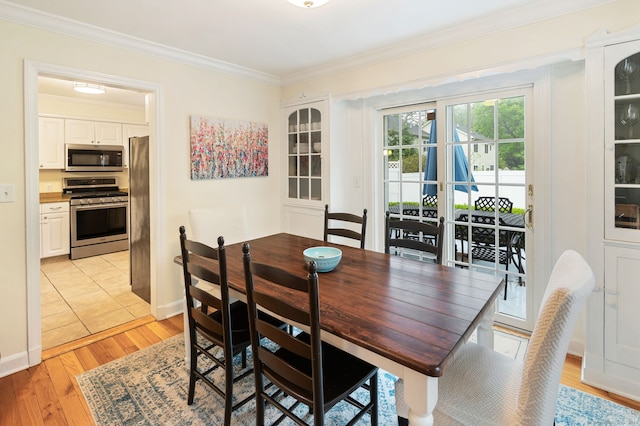 94 Mulberry St, Stamford, CT 06907 - dining space with ornamental molding and light wood-type flooring