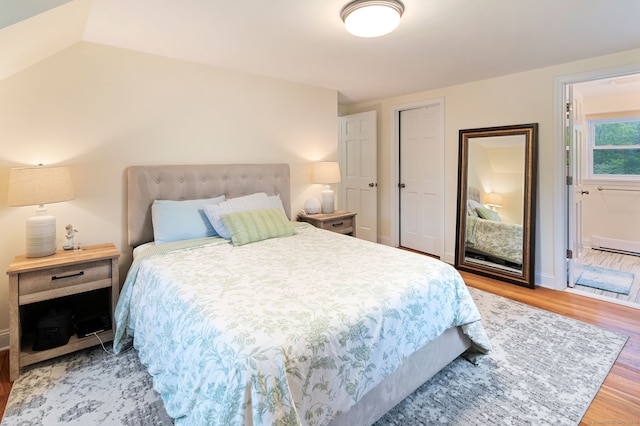 94 Mulberry St, Stamford, CT 06907 - bedroom with wood finished floors, baseboard heating, and a closet