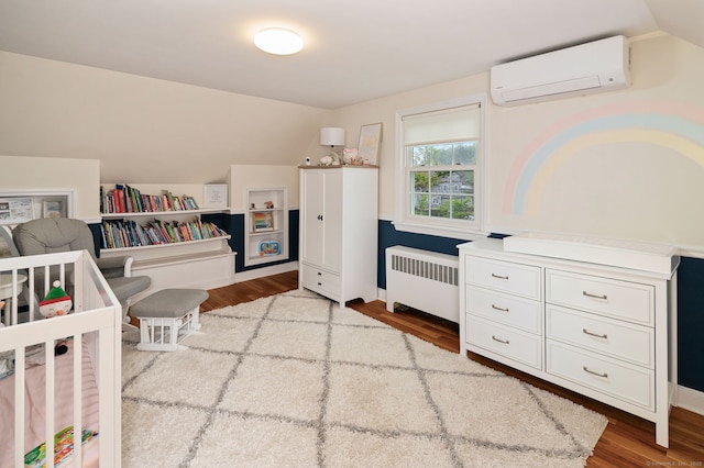 94 Mulberry St, Stamford, CT 06907 - bedroom featuring radiator, a wall mounted AC, lofted ceiling, and wood finished floors