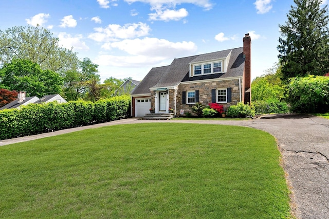 94 Mulberry St, Stamford, CT 06907 - view of front of house with asphalt driveway, a chimney, stone siding, a front yard, and a garage